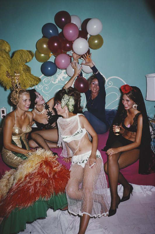 Five women in costumes partying at Emi Fors, Acapulco, Mexico, 1966