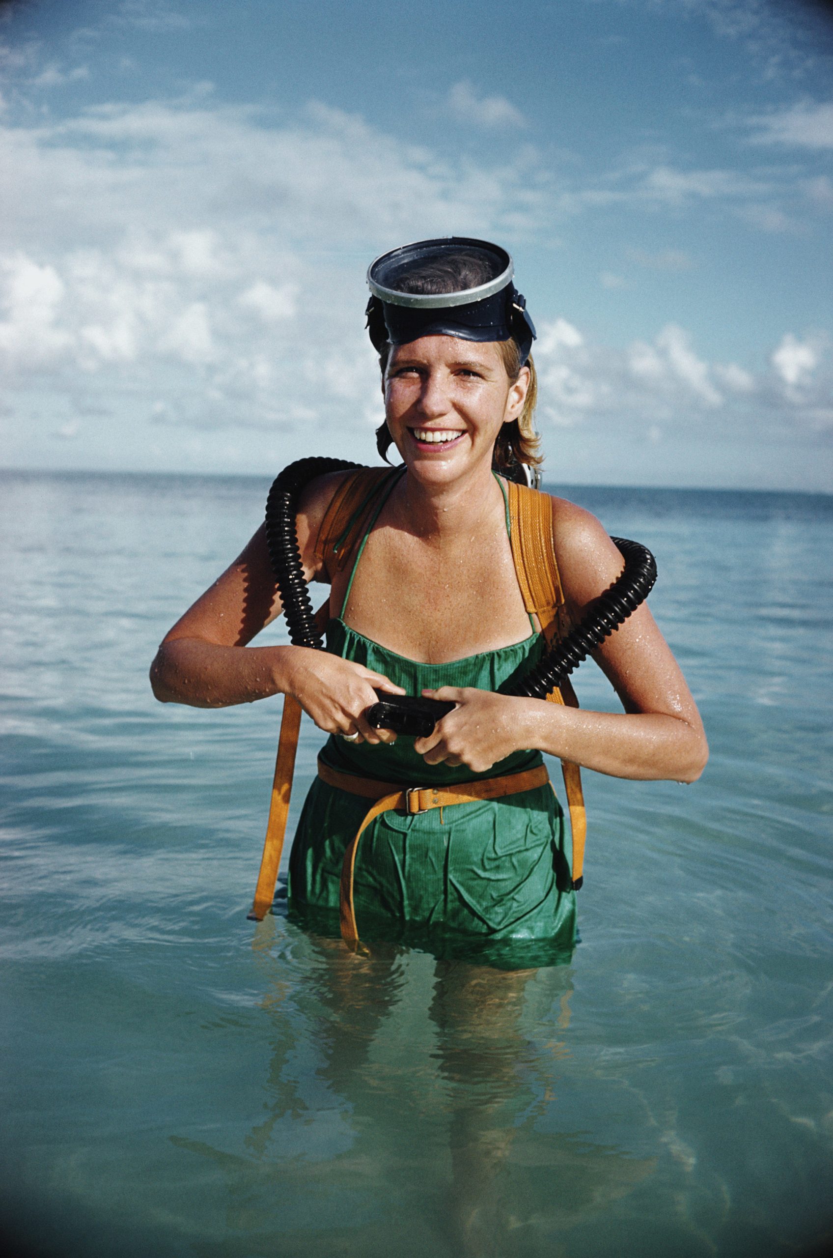 A woman prepares to go snorkeling in Lyford Cay, Bahamas, March 1962.