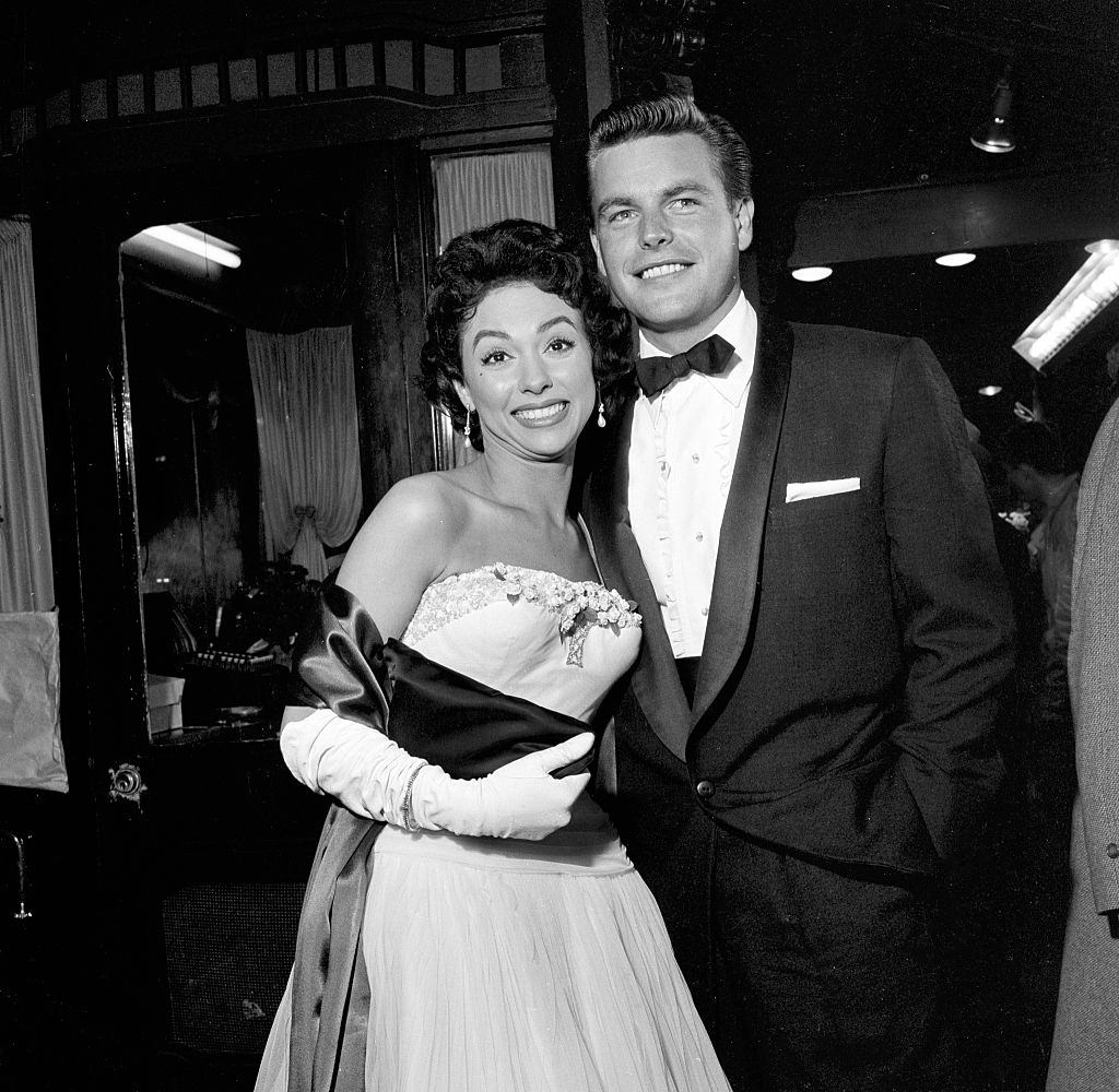 Rita Moreno and Robert Wagner attend the movie premiere of "Grey Flannel Suit", 1955.