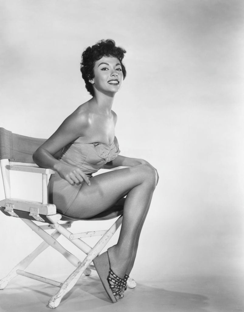 Rita Moreno posing on the chair, 1955.