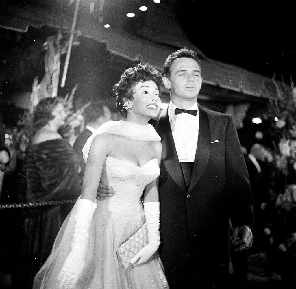 Rita Moreno and John Hudson attend the movie premiere of the 'Egyptian', 1954.