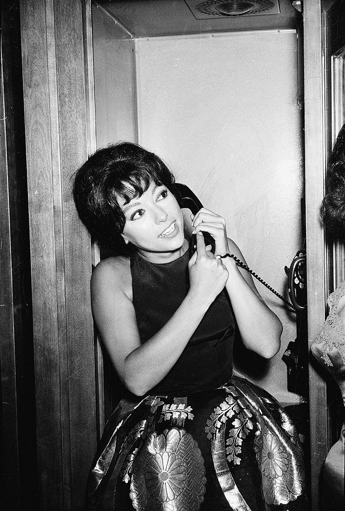 Rita Moreno speaks on the telephone after winning the 'Actress In a Supporting Role' award for the film 'Westside Story', 1962.