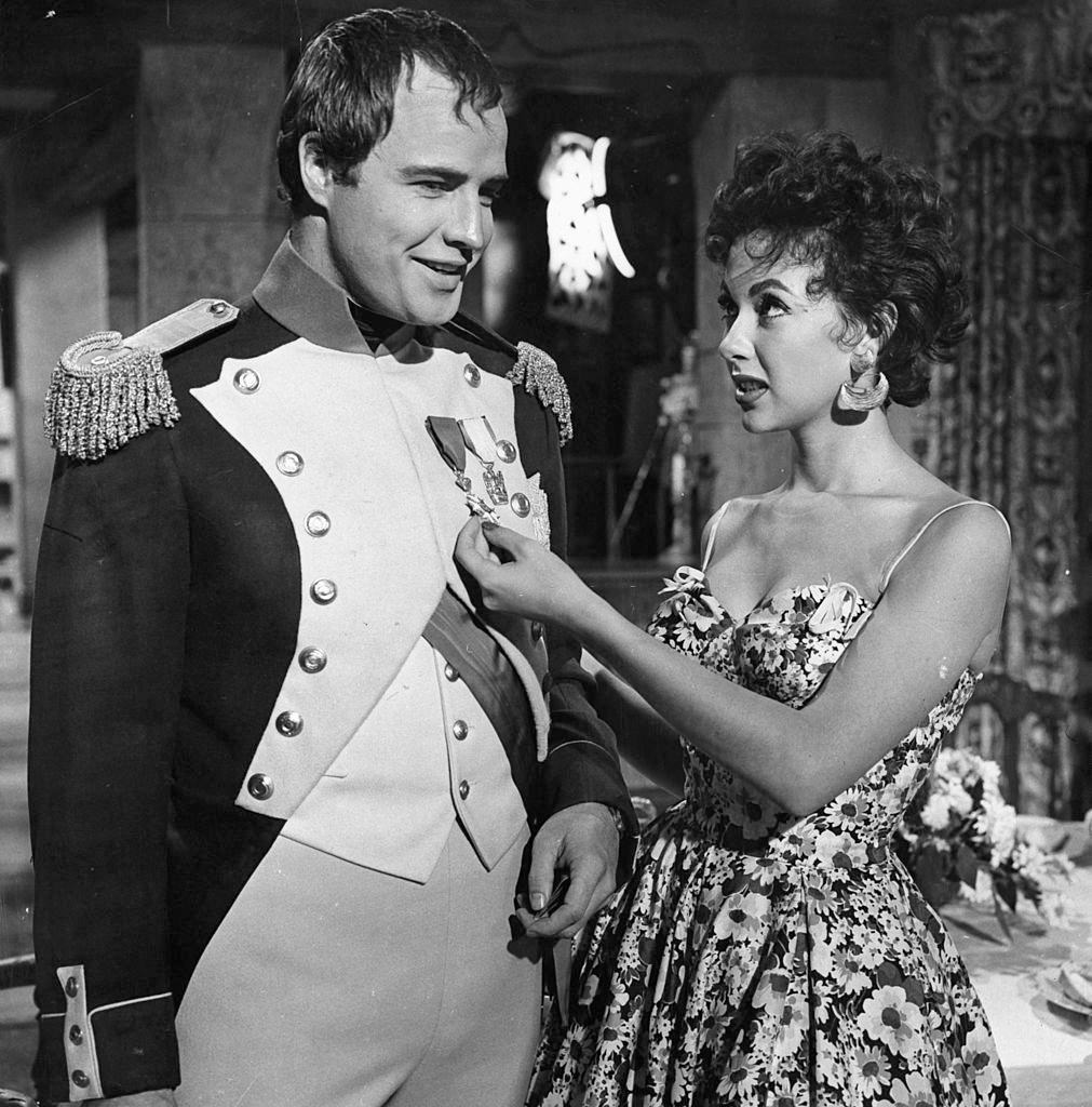 Rita Moreno with Marlon Brando on the set of the film 'Desiree', 1954.
