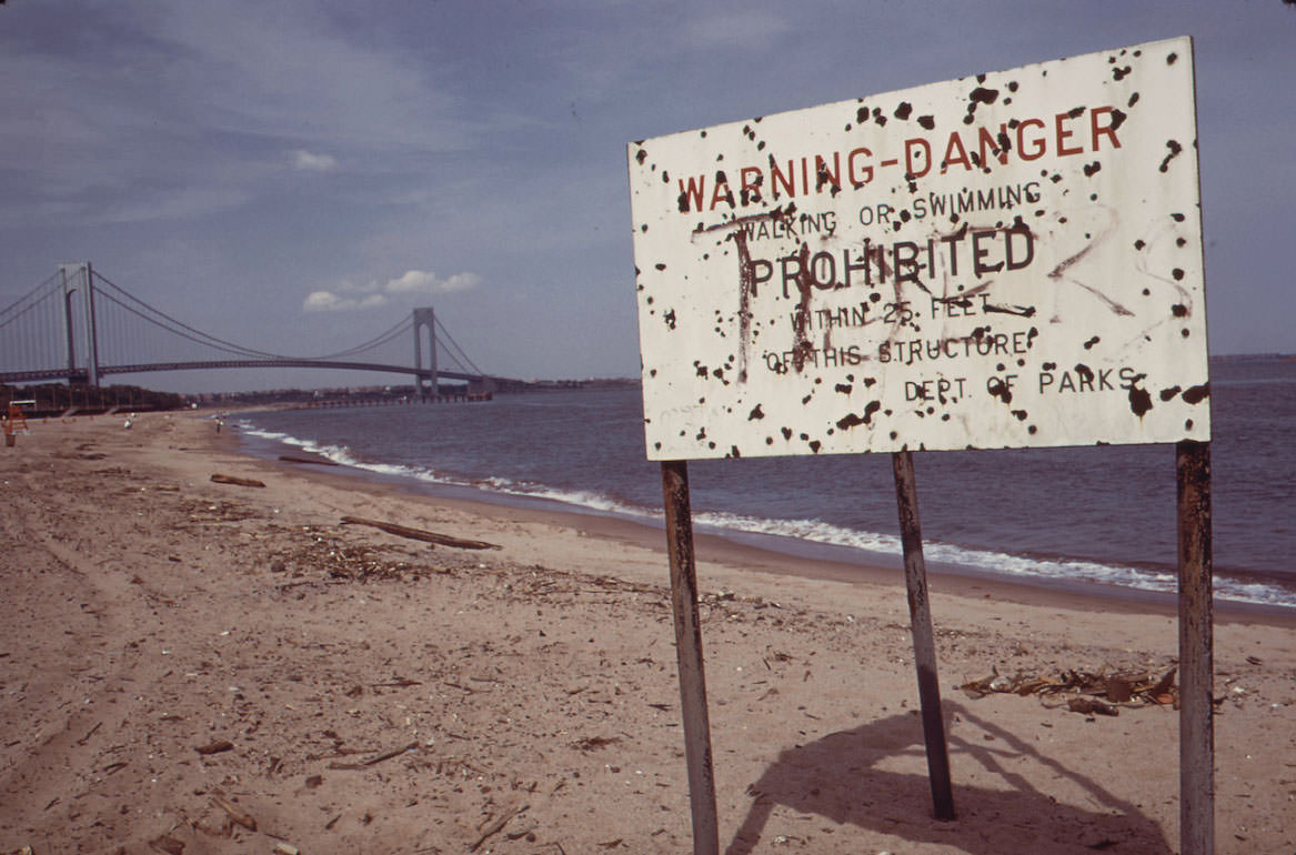 Warning of Polluted Water at Staten Island Beach Verrazano-Narrows Bridge in Background, June 1973