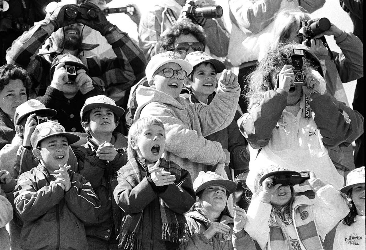 Classmates of Christa McAuliffe’s son cheer as the Challenger launches skyward.