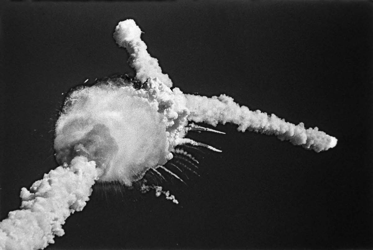 The Challenger explodes 73 seconds into flight, nine miles above the Atlantic Ocean.
