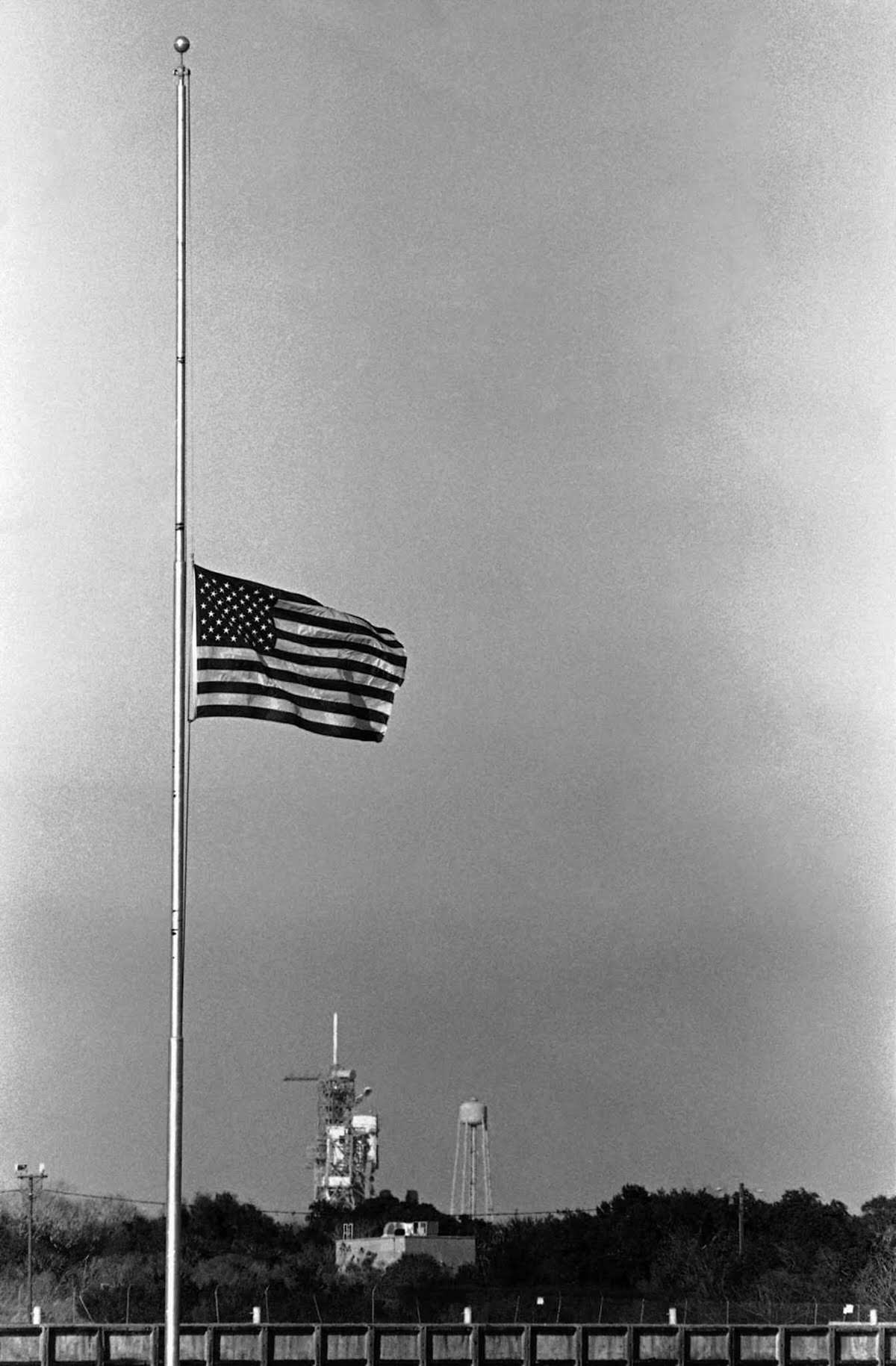 A flag flies at half-mast at Kennedy Space Center after the explosion.