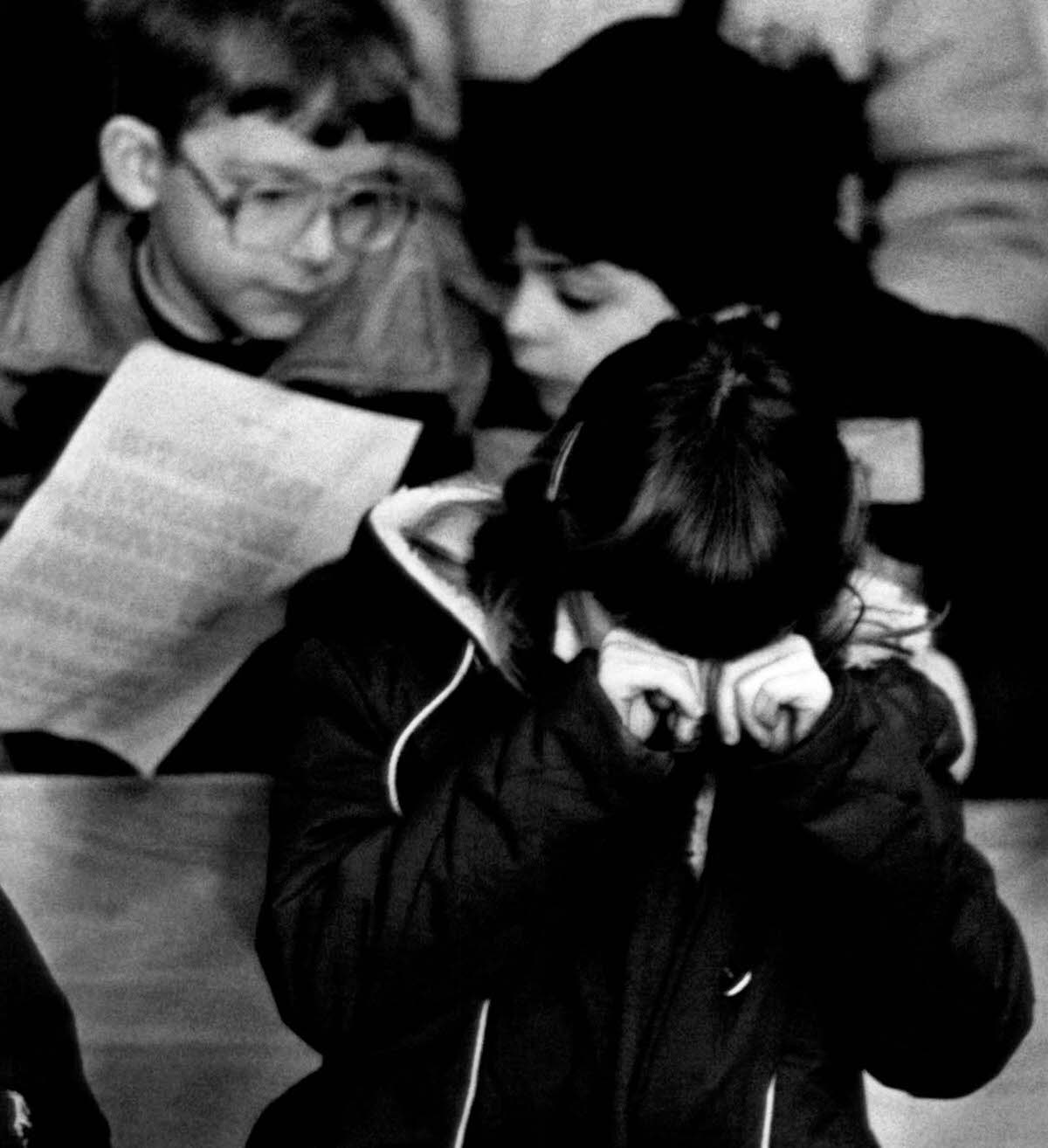 A child cries during a memorial service for Christa McAuliffe at a church in Concord, New Hampshire.