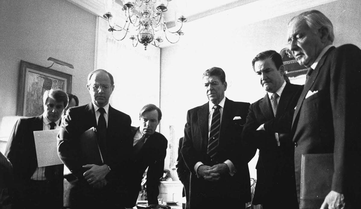 President Ronald Reagan and members of his senior staff watch a replay of the disaster. Feb. 3, 1986.