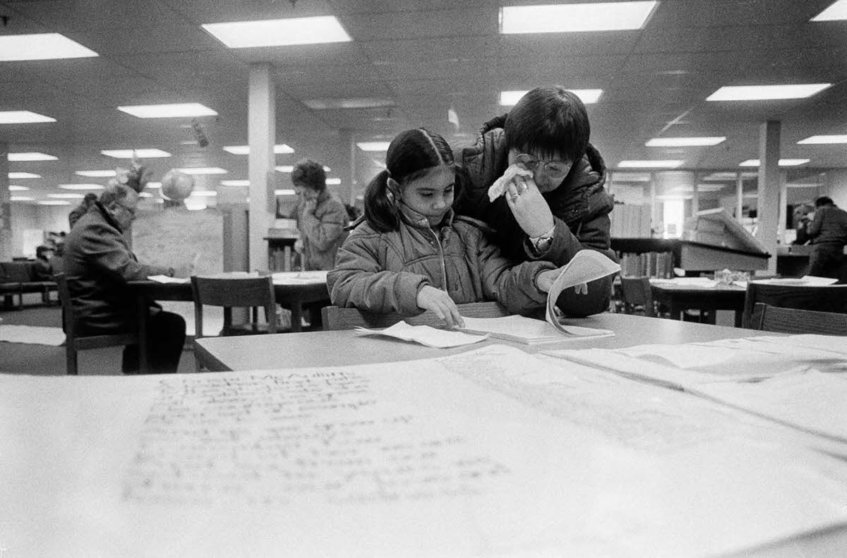 Lisa Mitten wipes tears from her eyes as her daughter Jessica reads some of the letters of sympathy from around the country on display at Concord High School.