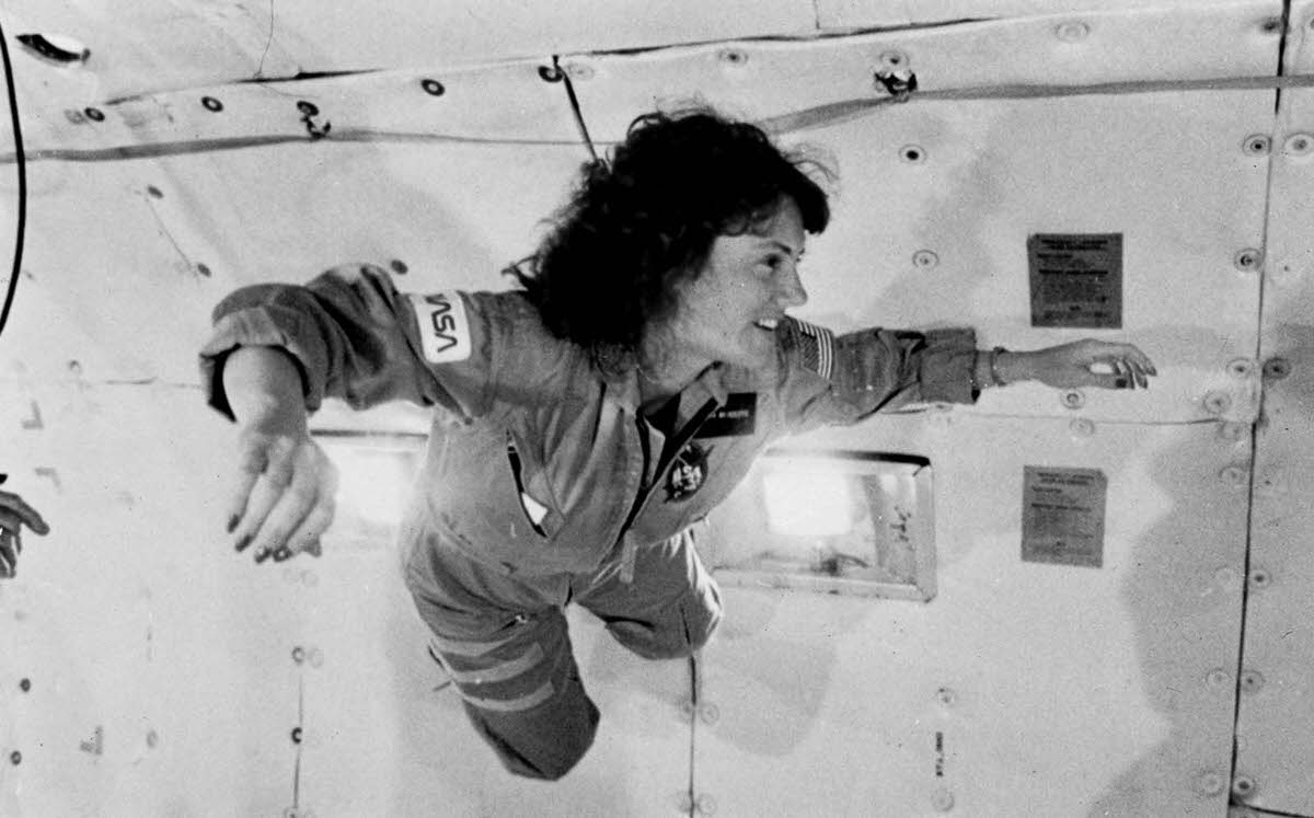 Christa McAuliffe experiences weightlessness for the first time aboard a NASA aircraft which flies in parabolic arcs to approximate zero gravity. January 1986.