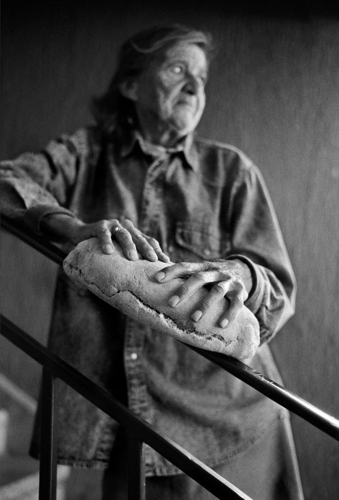 A woman holds a precious loaf of bread during the siege of Sarajevo, 1995.