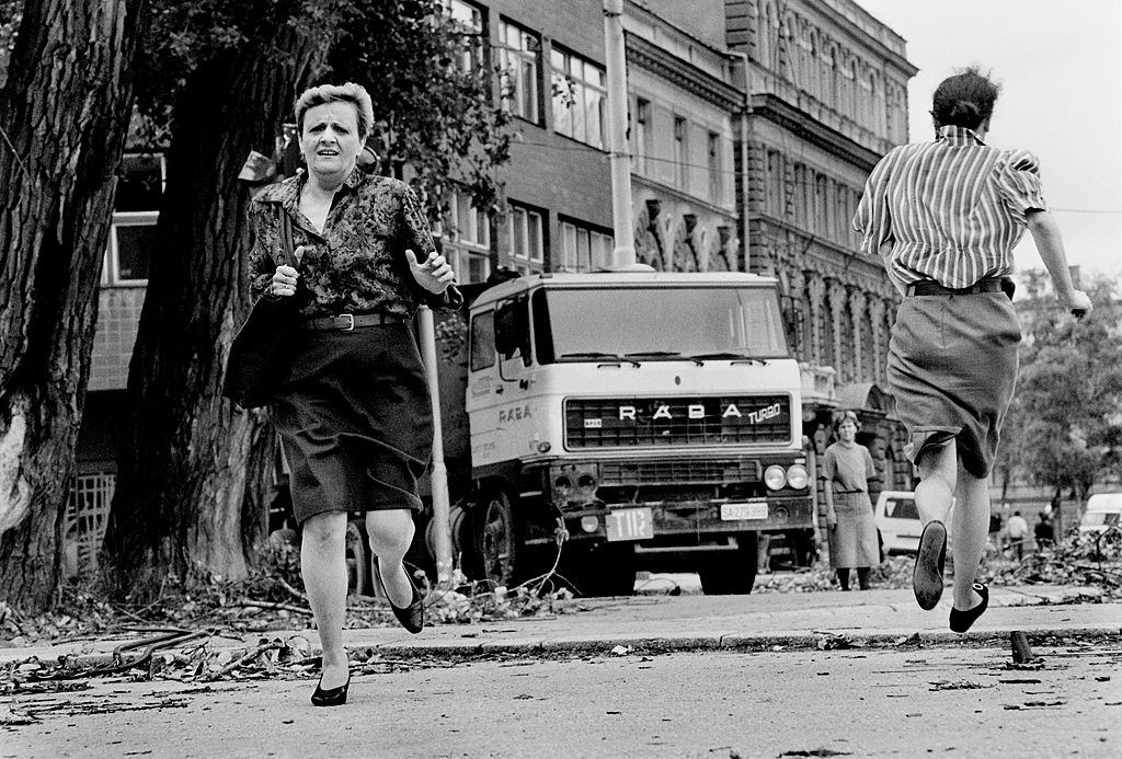 Women run for their lives across 'Sniper Alley' under the sights of Serb gunmen during the siege of Sarajevo.