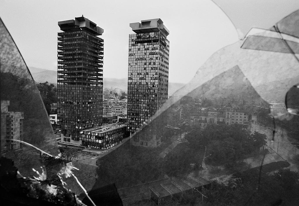 The burnt out tower blocks of Sarajevo's financial district seen through the shattered windows of the Holiday Inn Hotel.