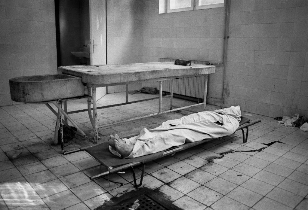 A body lies in a morgue during the four year siege of Sarajevo, 1994.
