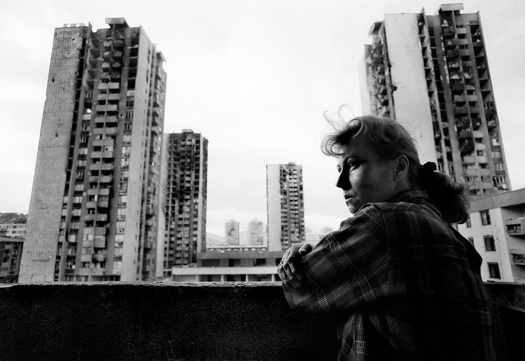 Minka Salihagic, photographed on the balcony of her apartment in the area known as Heroes Square, so called because of the extreme dangers of living there during the war, in Sarajevo.