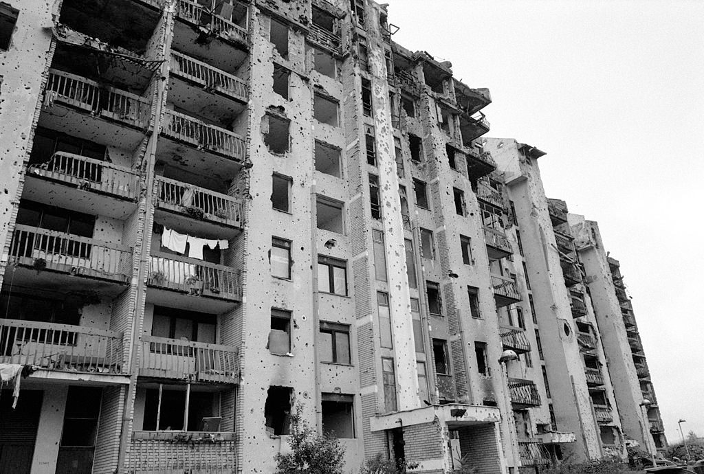 The first signs of rebirth and rebuilding as washing hangs on the balcony of a shell damaged apartment block on Sarajevo's frontline.