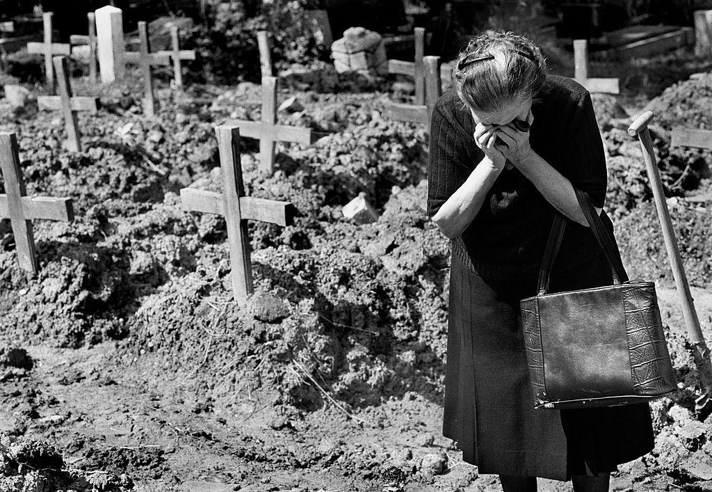 A woman weeps in the Lion Cemetery where Sarajevo citizens were buried.