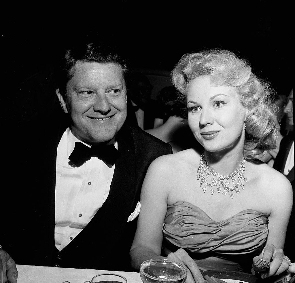 Virginia Mayo with her husband Michael O'Shea attends a party in Los Angeles, 1952.