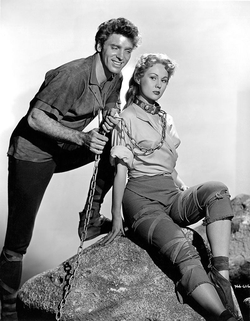 Burt Lancaster ties up Virginia Mayo with a chain in a scene from the movie 'The Flame and the Arrow', 1950.