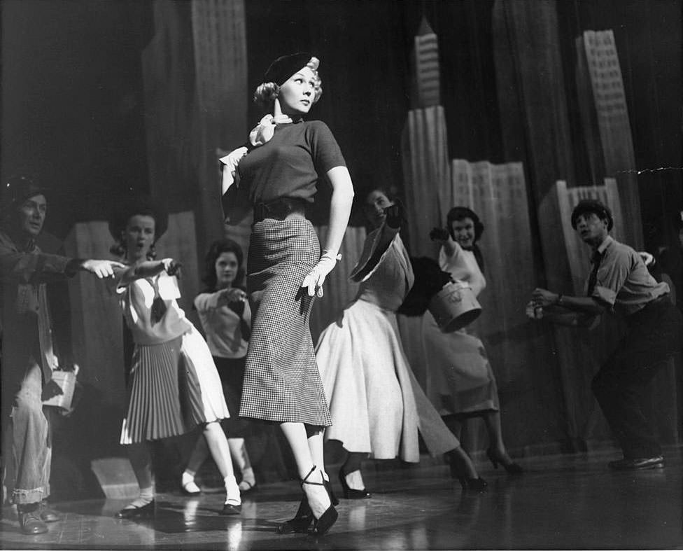 Virginia Mayo on stage performing in a scene from the film 'She's Back On Broadway', 1953.