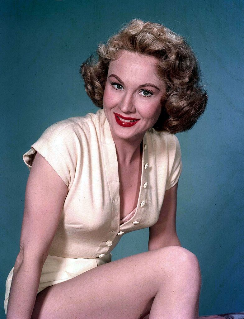 Virginia Mayo wearing yellow outfit, Portrait, 1955.