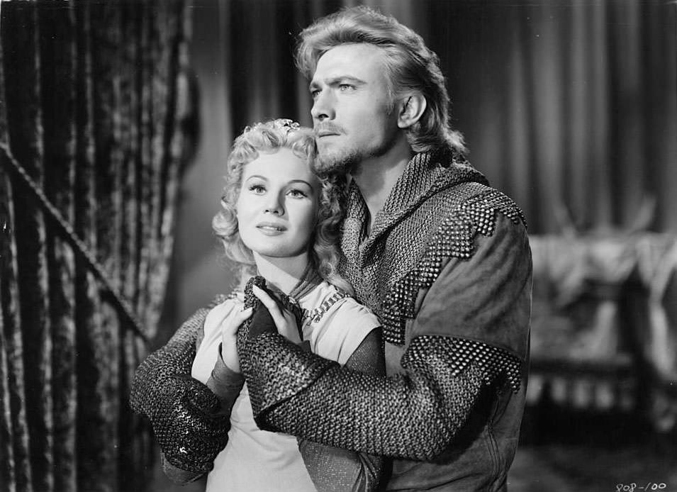 Laurence Harvey holding onto Virginia Mayo in a scene from the film 'King Richard And The Crusaders', 1954.