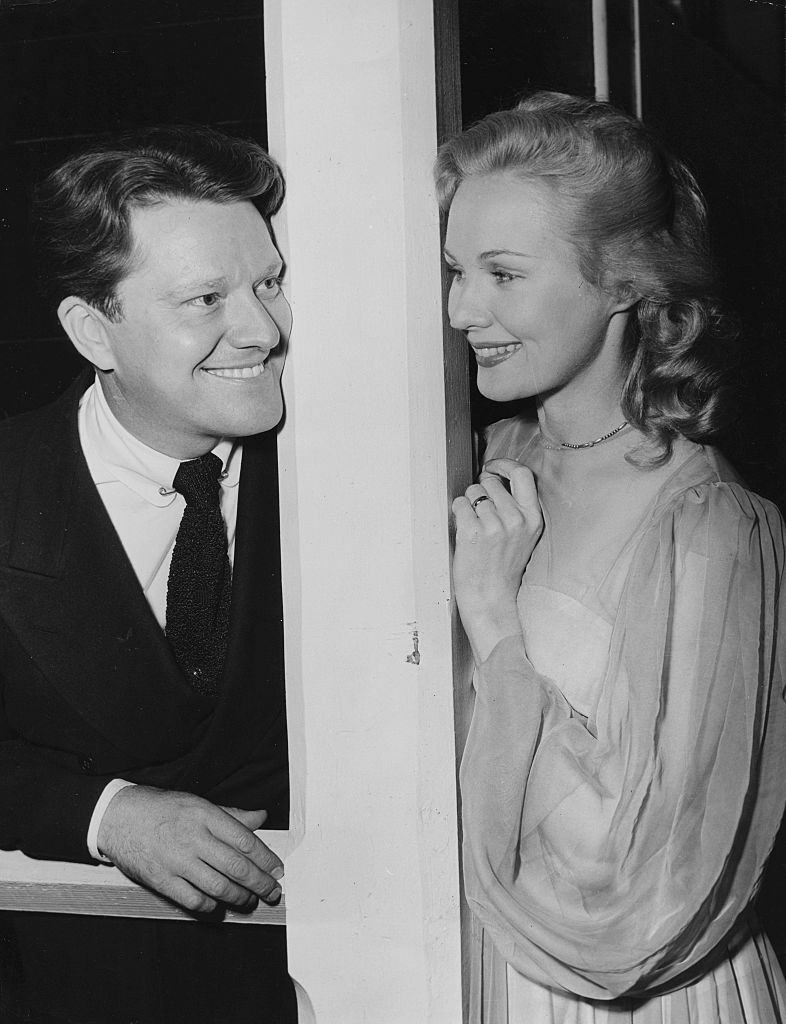 Virginia Mayo with Michael O'Sheaposing for pictures on their wedding day, at the Little Church of the Flowers, Hollywood, 1947.