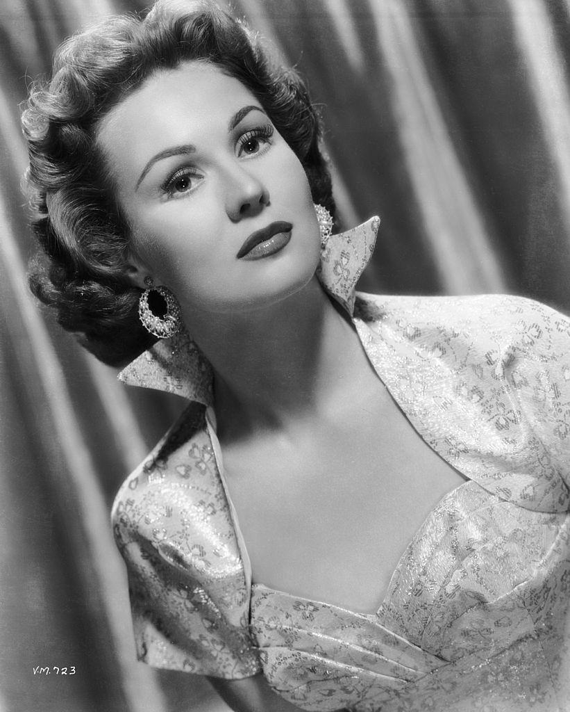 Virginia Mayo in a high-collared dress, 1950.