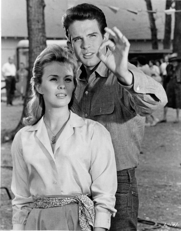 Jean Seberg watches as Warren Beatty gives the 'ok' sign in a scene from the film 'Lilith', 1964.