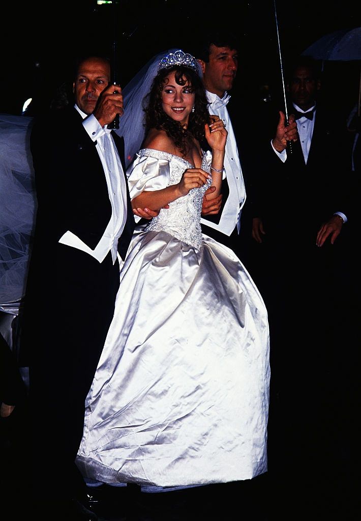 Mariah Carey with her husband Tommy Mottola on her wedding day, 1993.