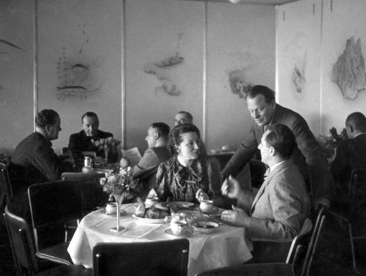 Passengers in the dining room of the Hindenburg, in April of 1936.