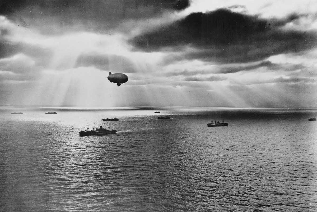 Sunset over the Atlantic finds a United States convoy moving peacefully towards it destination during World War II.