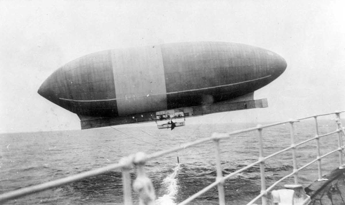 Wellman airship “America” viewed from the RMS TRENT, shown dragging her anchor, ca 1910.