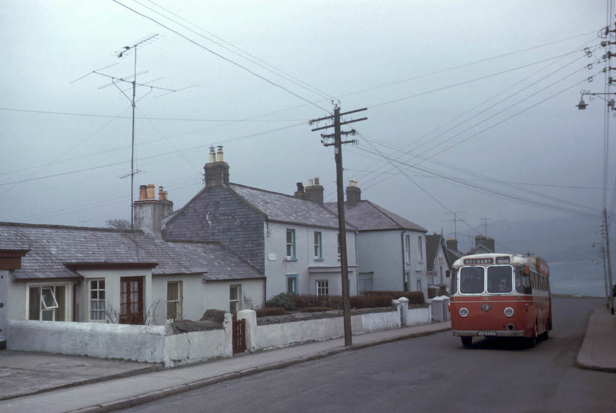 Bus on residential street, 1964 Bus on residential street, 1964