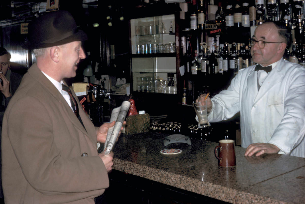 Dublin, bartender and customer in Bruxelles Bar 1964 Dublin, bartender and customer in Bruxelles Bar 1964