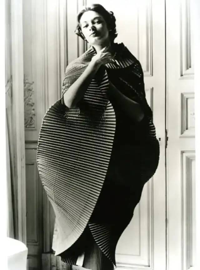 Jacqueline Marsel in finely plisséd dress opened into a cocoon, by Elsa Schiaparelli, photo by Regina Relang, Paris, 1951