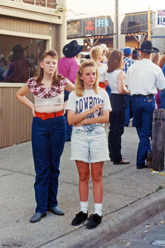 Teenage girls watching scene, Ft. Worth Stockyards, June 1993