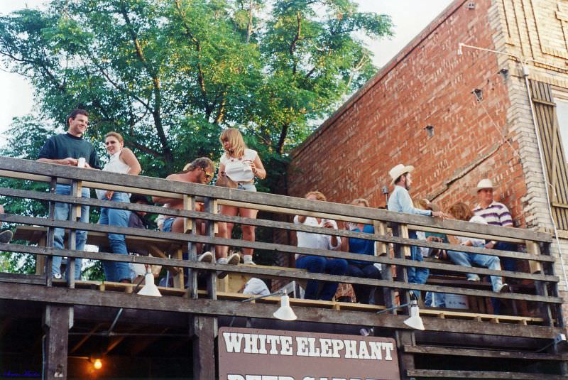 The roof deck provides saloon patrons a vantage point to watch the crowds at the Chisholm Trail Roundup, Ft. Worth Stockyards, June 1993