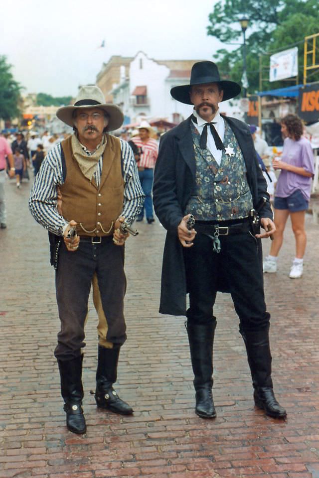 Gun-toting sheriff and his deputy pose at a festival at the Fort Worth Stockyards, probably the Chisholm Trail Roundup, Fort Worth Stockyards, June 1994