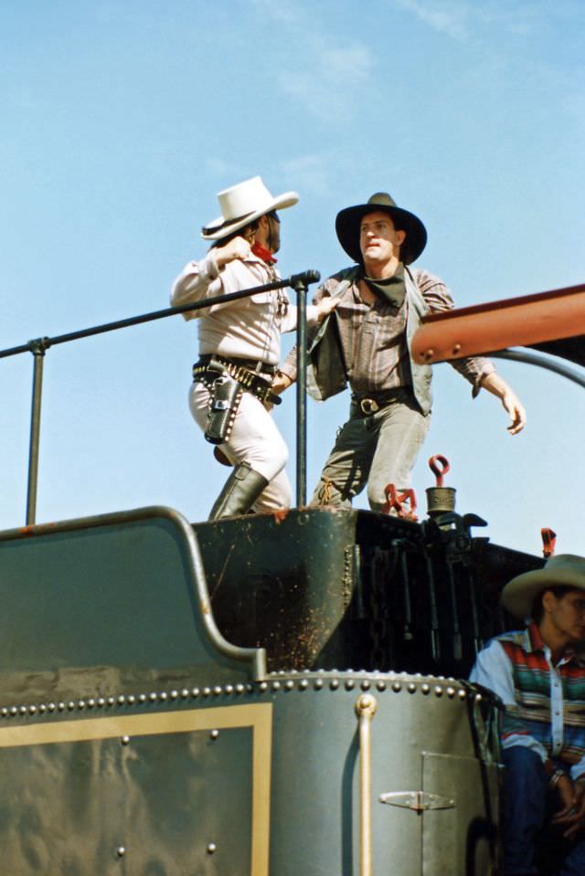 The Lone Ranger fights a train robber atop the Tarantula Railroad locomotive's tender, Chisholm Trail Roundup, Fort Worth Stockyards, June 1995