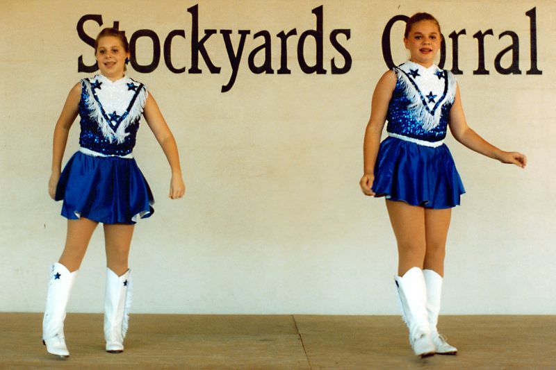 Two girls dance at Stockyards festival, Fort Worth Stockyards, September 1995