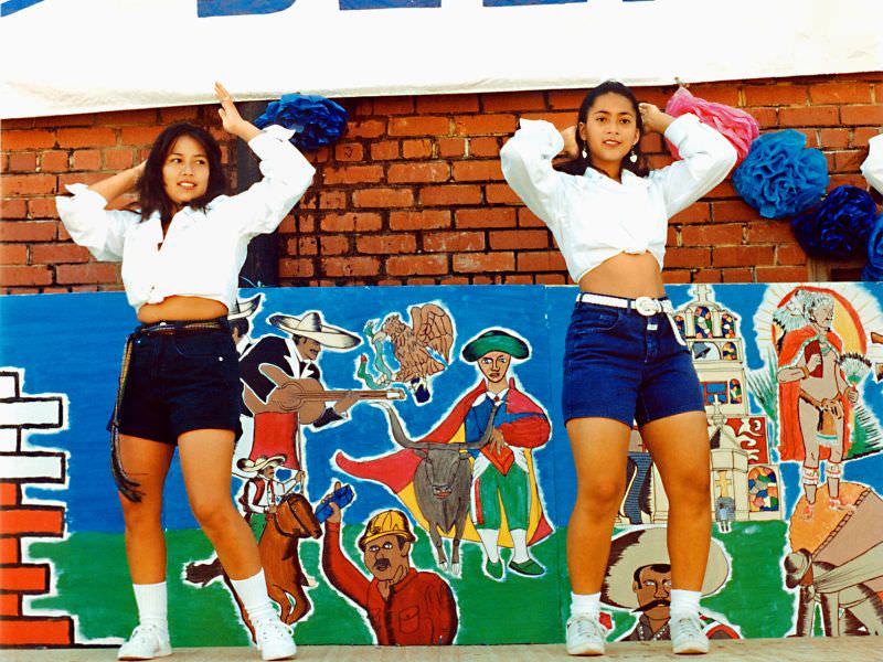 Two pretty Hispanic girls perform a dance at a festival at the Fort Worth Stockyards, June 1995