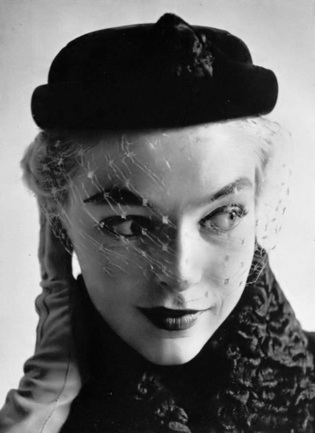 Joan Olson in taupe little cap with honey-colored voilette by Christian Dior, 1952