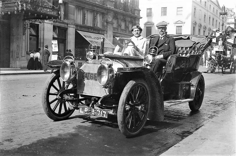 London. William Cochrane and his driver are seen parked across from the Carlton Hotel