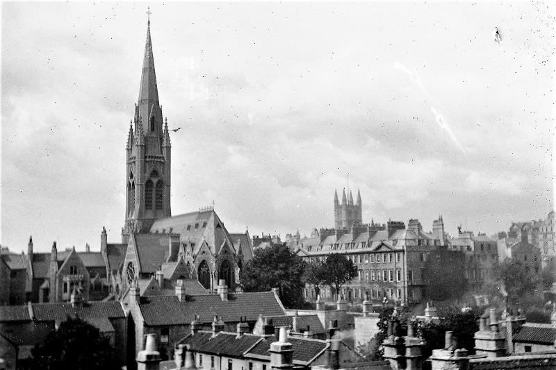 Bath from the train, showing the Catholic church of St John and the tower of the Abbey, Somerset.