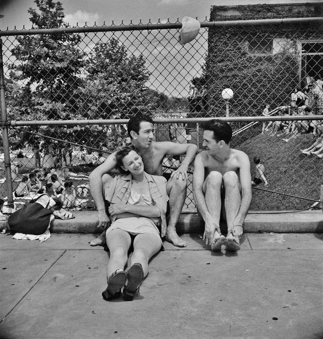 Relaxing on the edge of the municipal swimming pool on Sunday, Washington, D.C., July 1942
