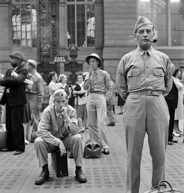 Waiting for trains at the Pennsylvania railroad station, in New York City, New York, August 1942