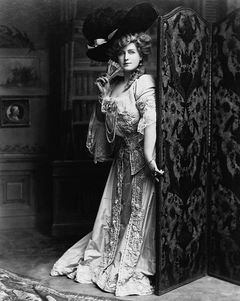 Lillian Russell in an elegantly designed gown and hat, 1890s.