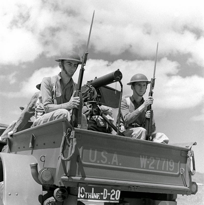 Young defenders beside a mounted machine gun, Hawaii, December 1941.
